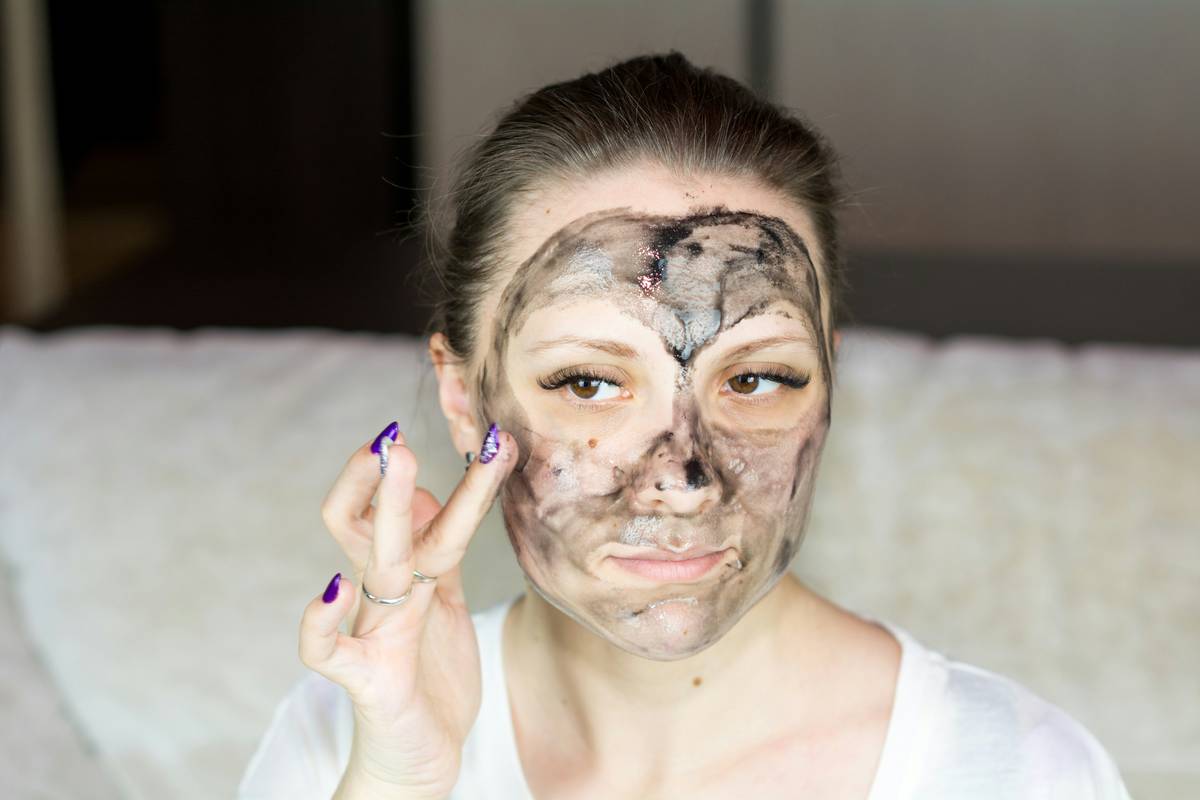 woman applying serum after taking anti aging collagen facial supplement